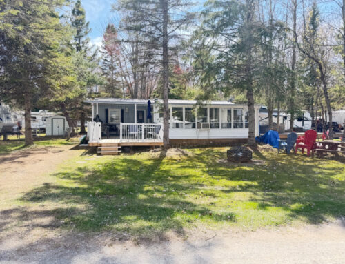 1990 – 40’ Palm Park Model With 3 Season Room & Hardtop Overhang. Asking: $68,500